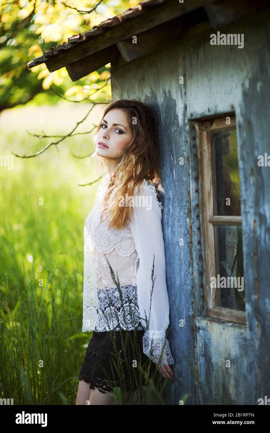 Portrait of a young woman, looking at camera Stock Photo - Alamy