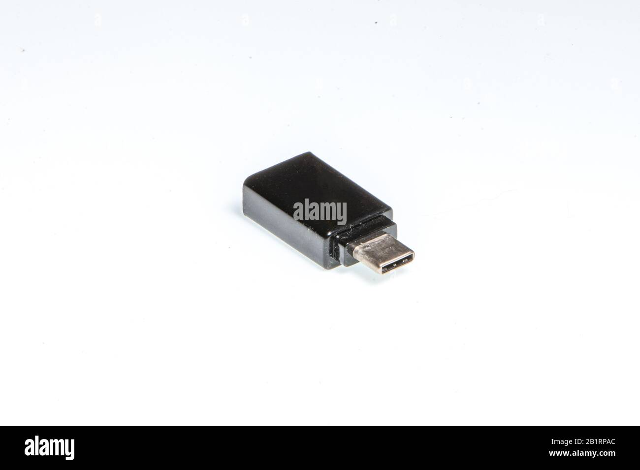 detail of a black usb-c adapter on a white background Stock Photo