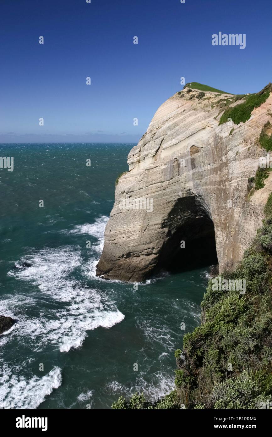 Rock arch opposite Cape Farewell, Golden Bay, South Island, New Zealand Stock Photo