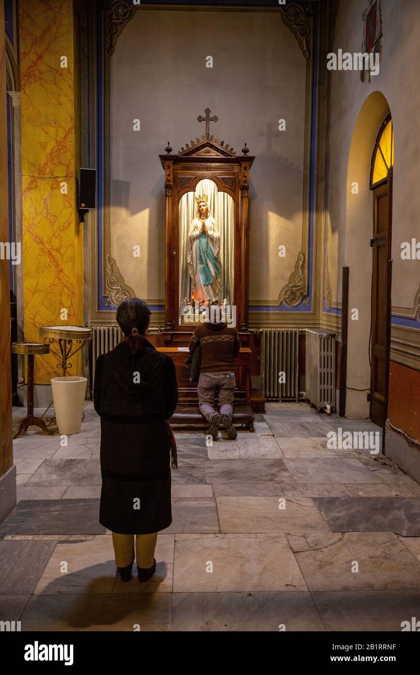 People praying in the Holy Spirit Cathedral, also known as the St