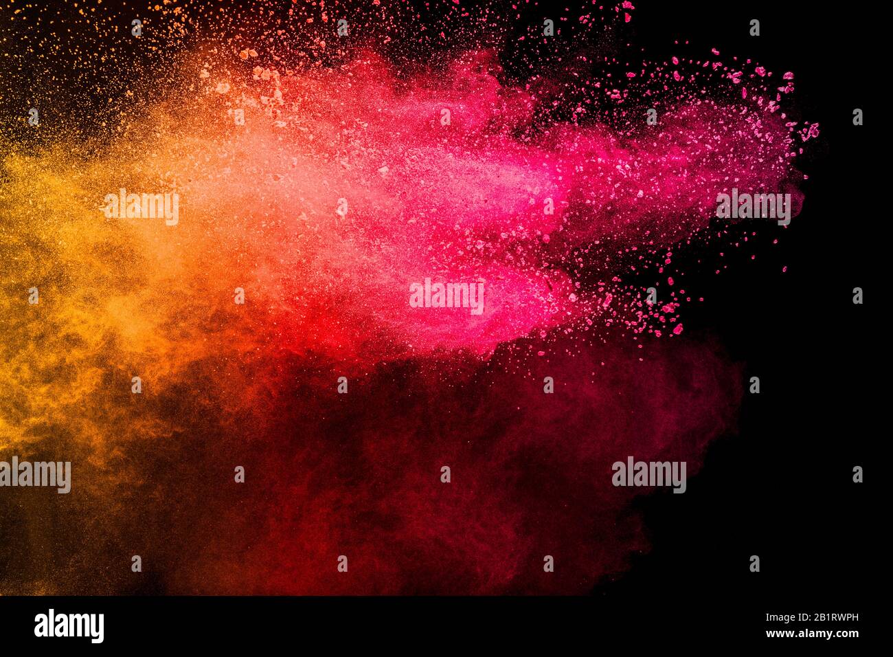 Freeze motion of red yellow color dust particles splashing Stock Photo ...