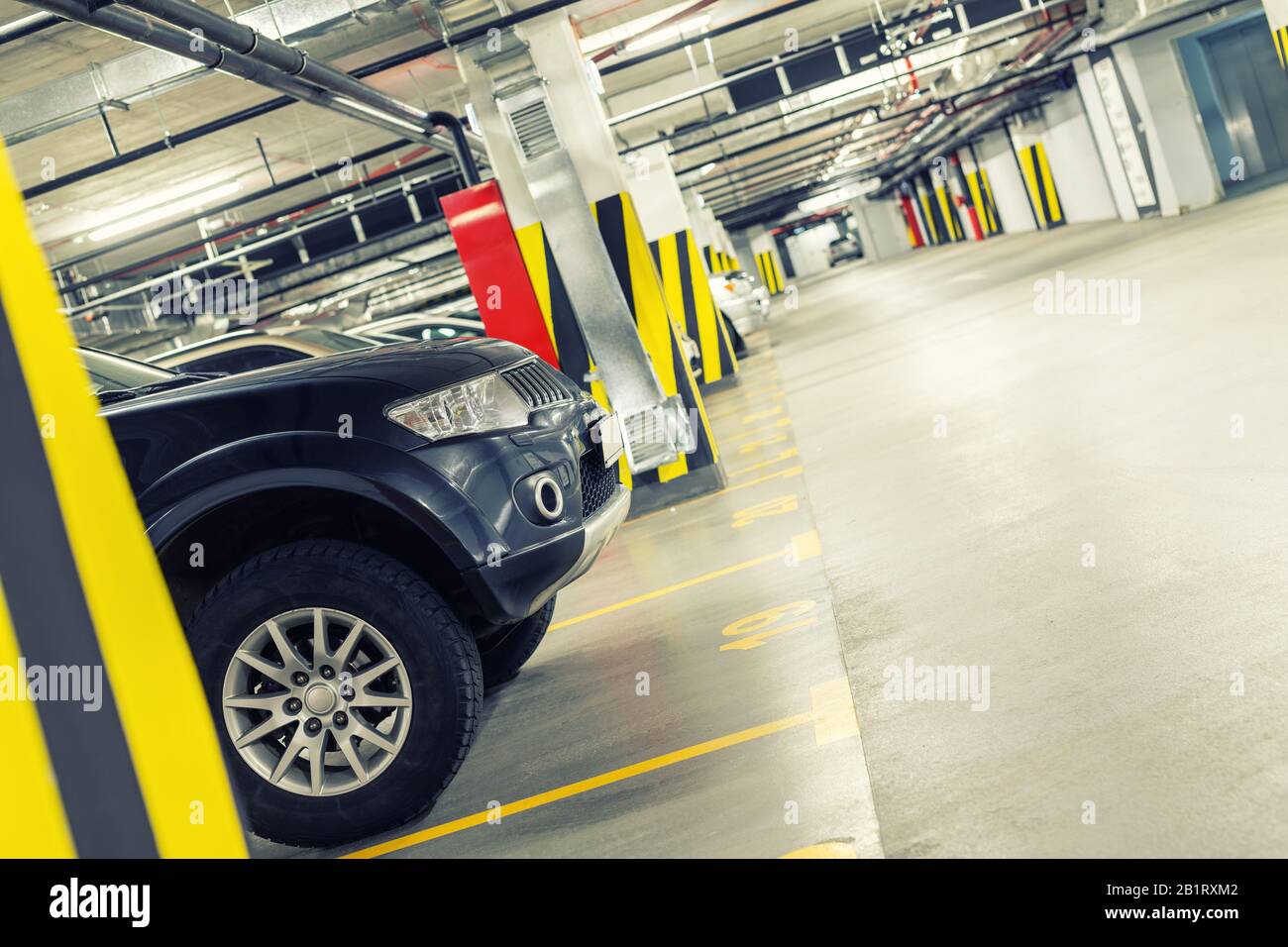 Underground car parking interior in basememnt floor shopping mall