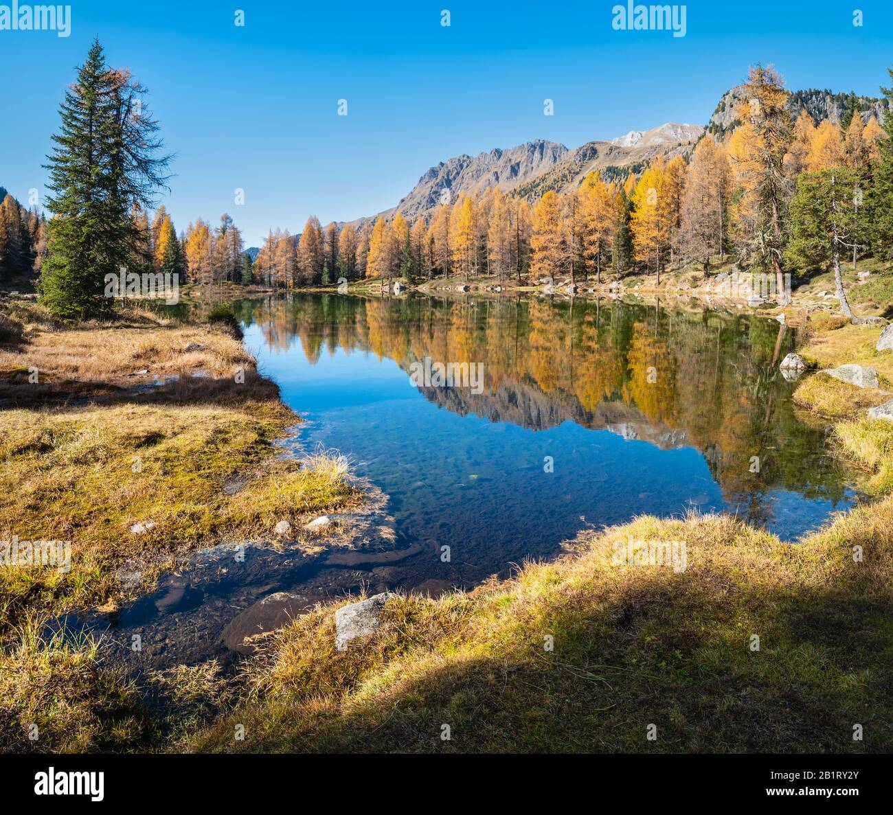 Autumn alpine mountain lake near San Pellegrino Pass, Trentino 