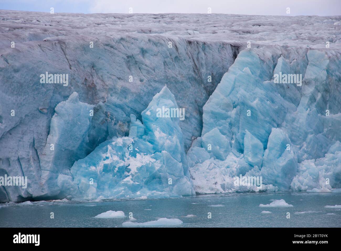 The glacier front on water. Melting and caving ice Stock Photo