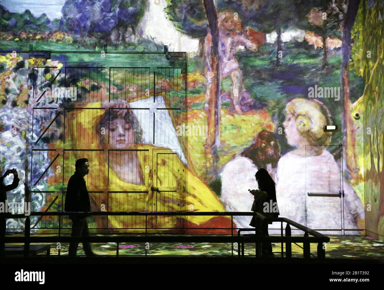 Paris, France. 27th Feb, 2020. People visit the digital exhibition titled 'Monet, Renoir.Chagall: Journeys around the Mediterranean' during a press review in Paris, France, Feb. 27, 2020. The digital exhibition to be held from Feb. 28, 2020 to Jan. 3, 2021 presents visitors with an itinerary that spans the period between Impressionism and modernism. The exhibition immerses visitors in the masterpieces of 20 artists, including Renoir, Monet, Matisse, Chagall, etc., and highlights the link between artistic creativity and the Mediterranean shores. Credit: Gao Jing/Xinhua/Alamy Live News Stock Photo