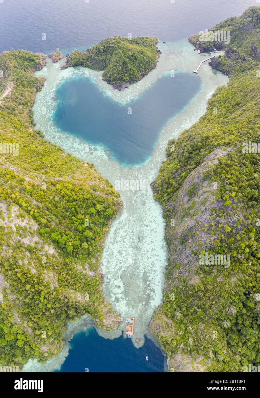 Healthy Coral Reefs Surround A Heart Shaped Lagoon In Raja Ampat