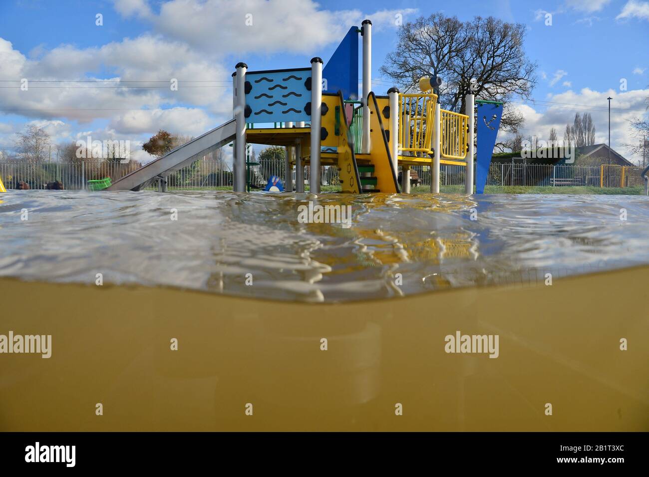 A playground sits partially submerged in floodwater in Tewkesbury, as