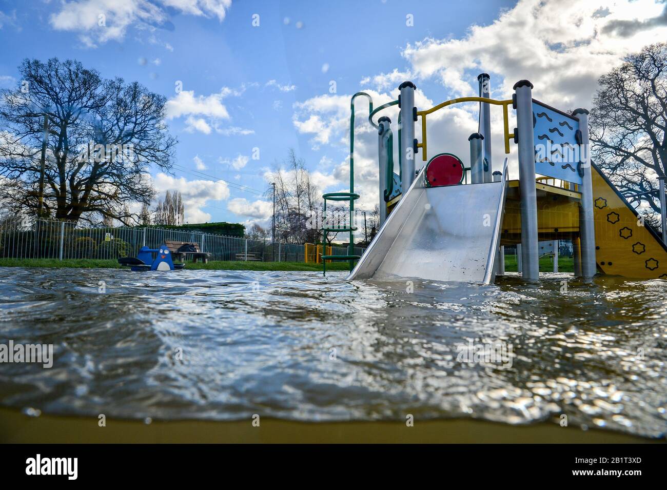 A playground sits partially submerged in floodwater in Tewkesbury, as