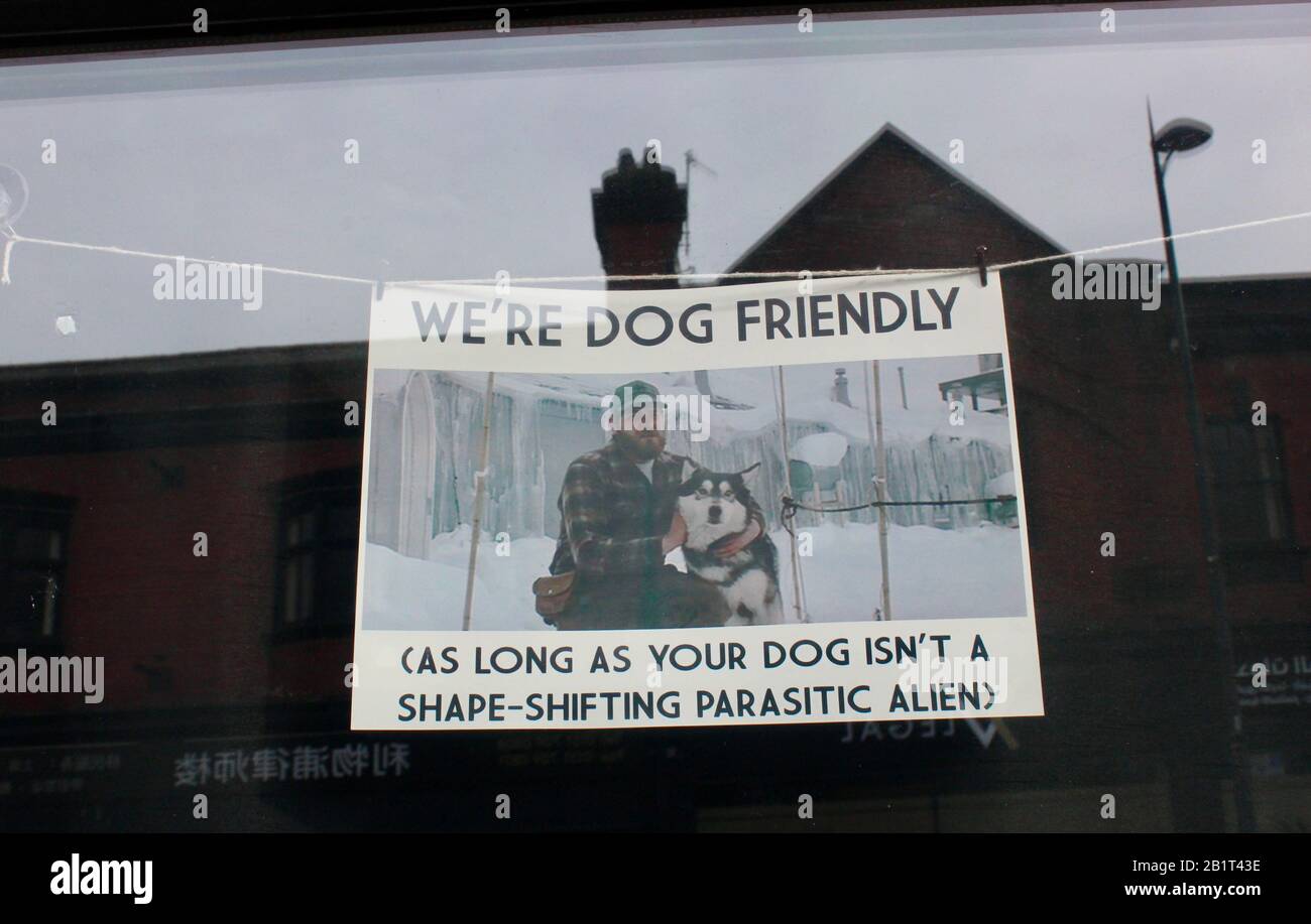 we're dog friendly as long as your dog isn't a shape-shifting parasitic alien funny sign in liverpool cafe england UK Stock Photo