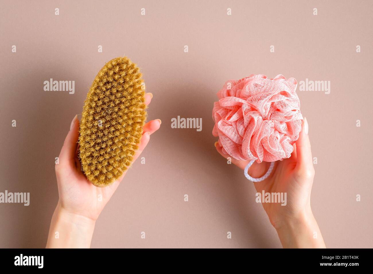 Bath shower sponge loofah vs ecofriendly natural bath massage brush comparison concept. Flat