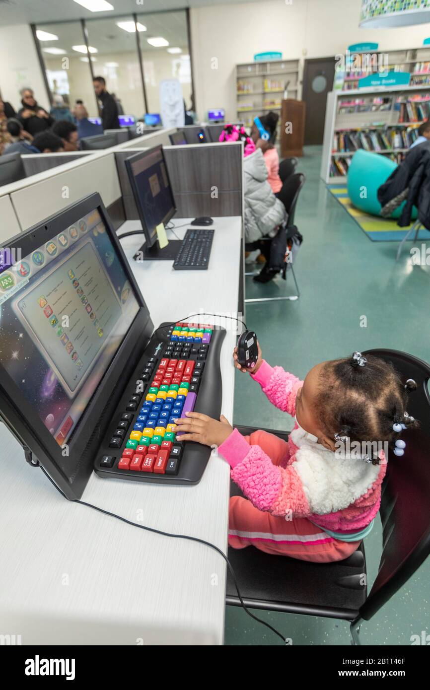 Child with computer technology hi-res stock photography and images - Alamy
