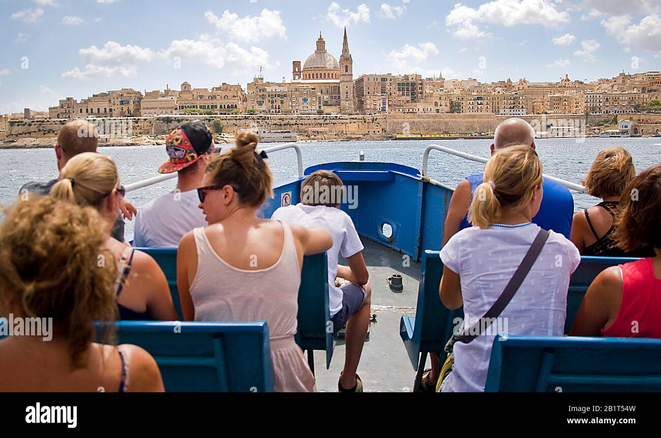 Tourists on ferry from Sliema to Valletta Malta Stock Photo