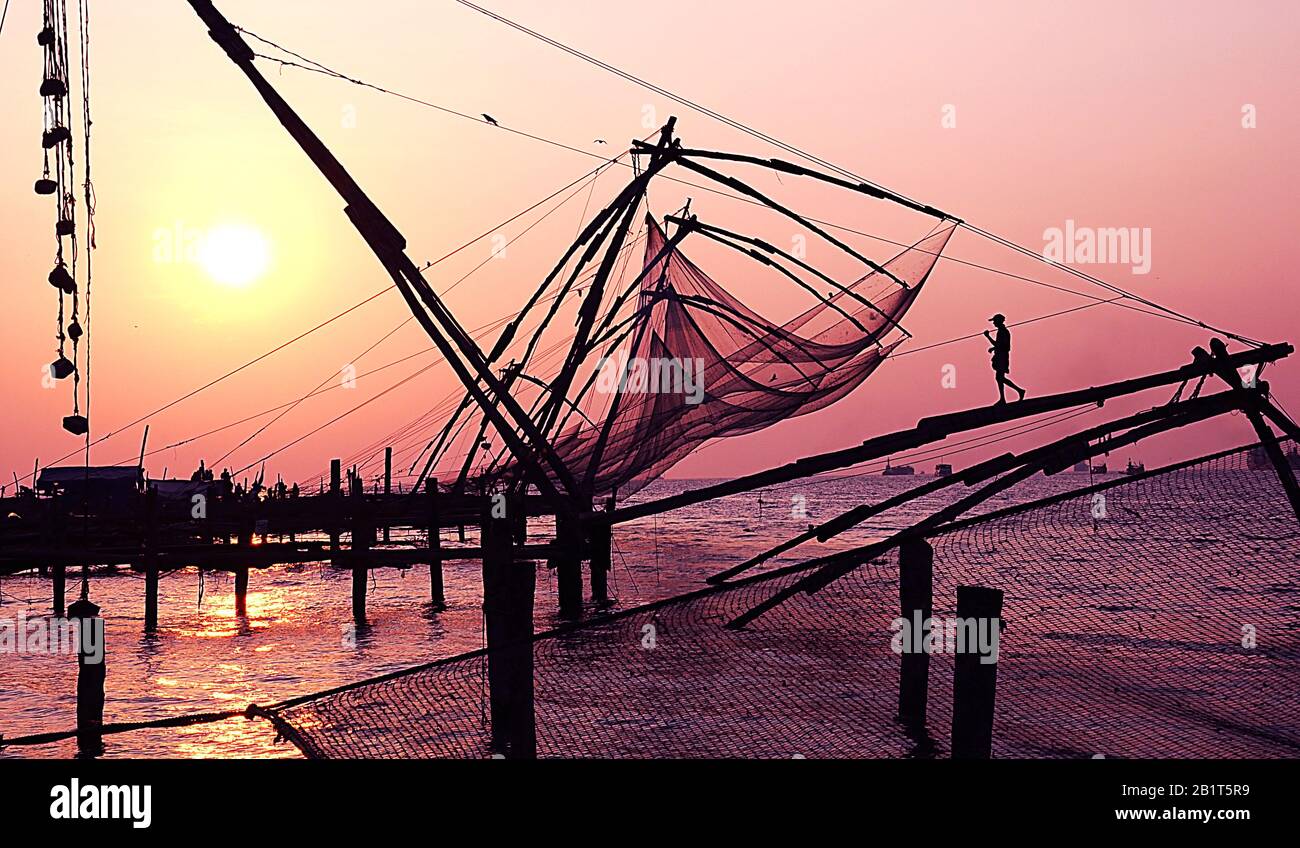 Sunset Fort  Kochi, Kerla India Chinese fishing nets Stock Photo