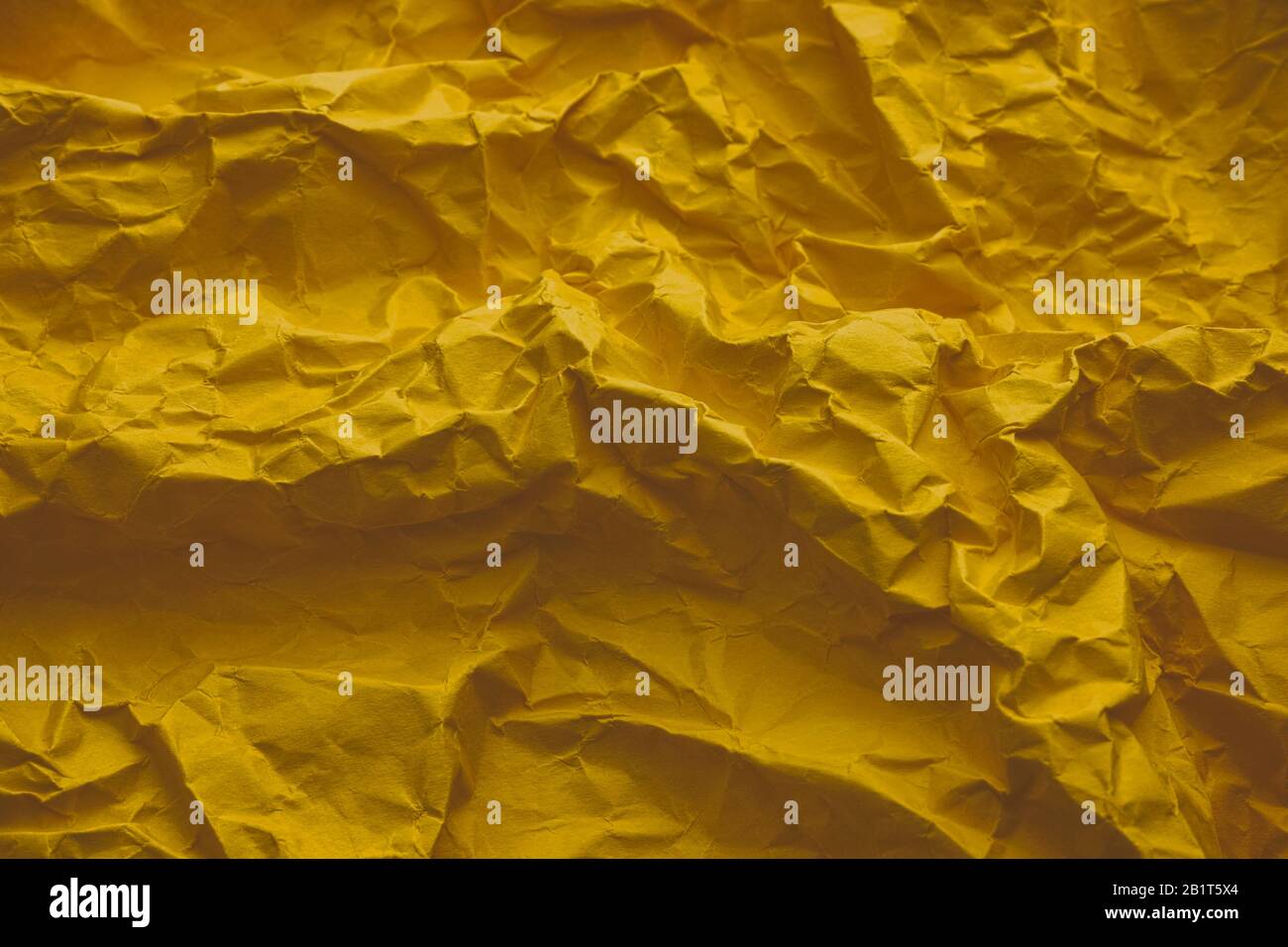 Yellow texture background. Crumpled paper. Stock Photo