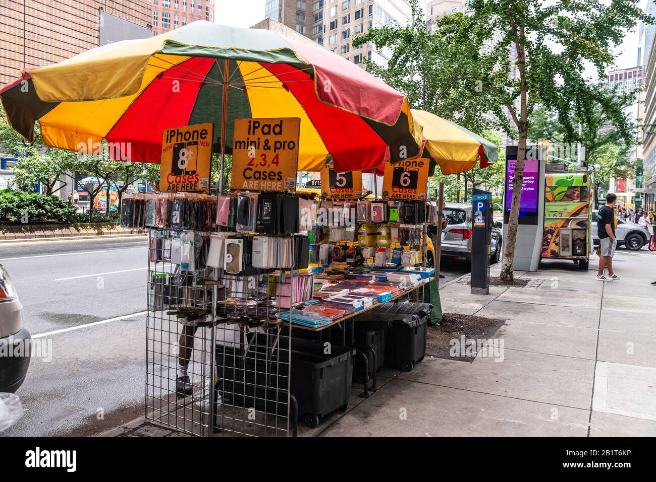 New York City, USA - August 3, 2018: Stall selling telephone and electronic accessories in the street with people around in Manhattan, New York City, Stock Photo