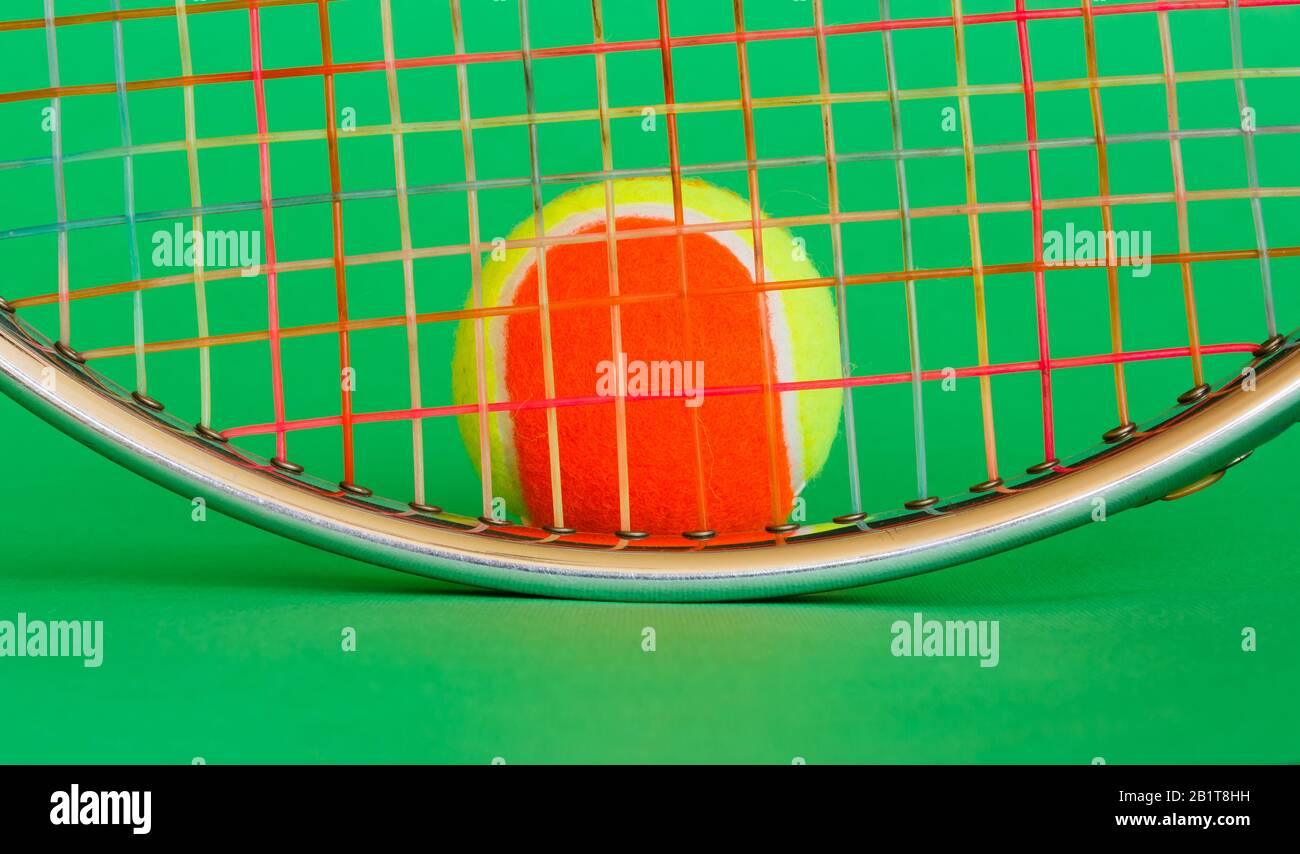 the oval of a tennis racket metal with strings of many colors and a