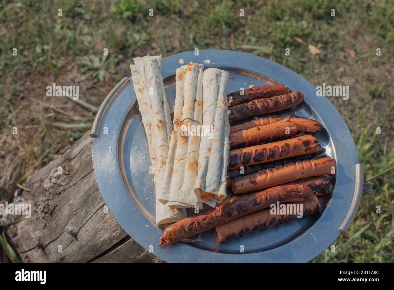 Grilled sausages on pita bread. Grilled pita bread and sausage Stock