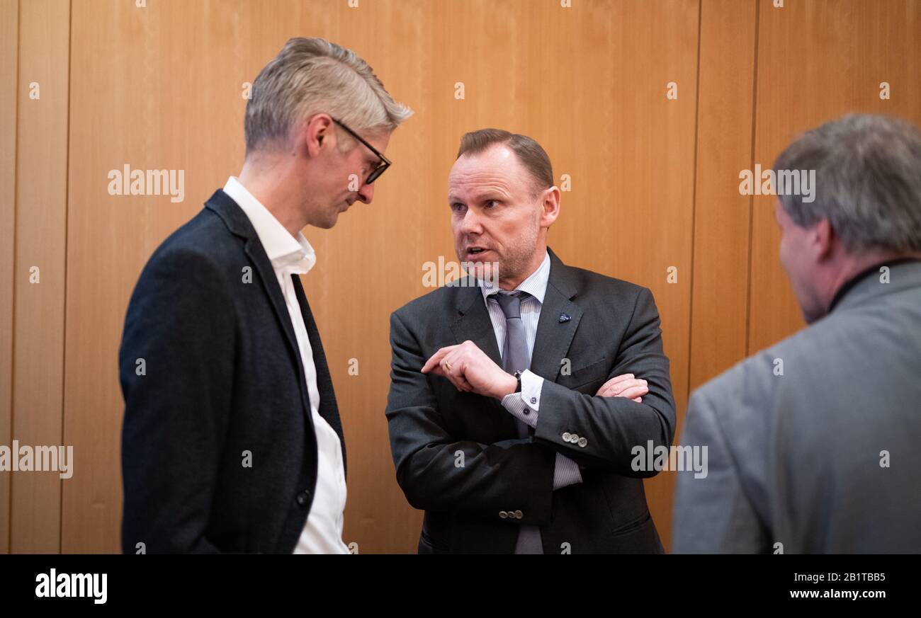 27 February 2020, Hamburg: Andy Grote (M, SPD), Senator of the Interior of Hamburg, talks to Hansjörg Schmidt (l, SPD), member of the Hamburg Parliament, at a meeting of the old and new members of the SPD faction in the Hamburg Parliament. Photo: Daniel Reinhardt/dpa Stock Photo