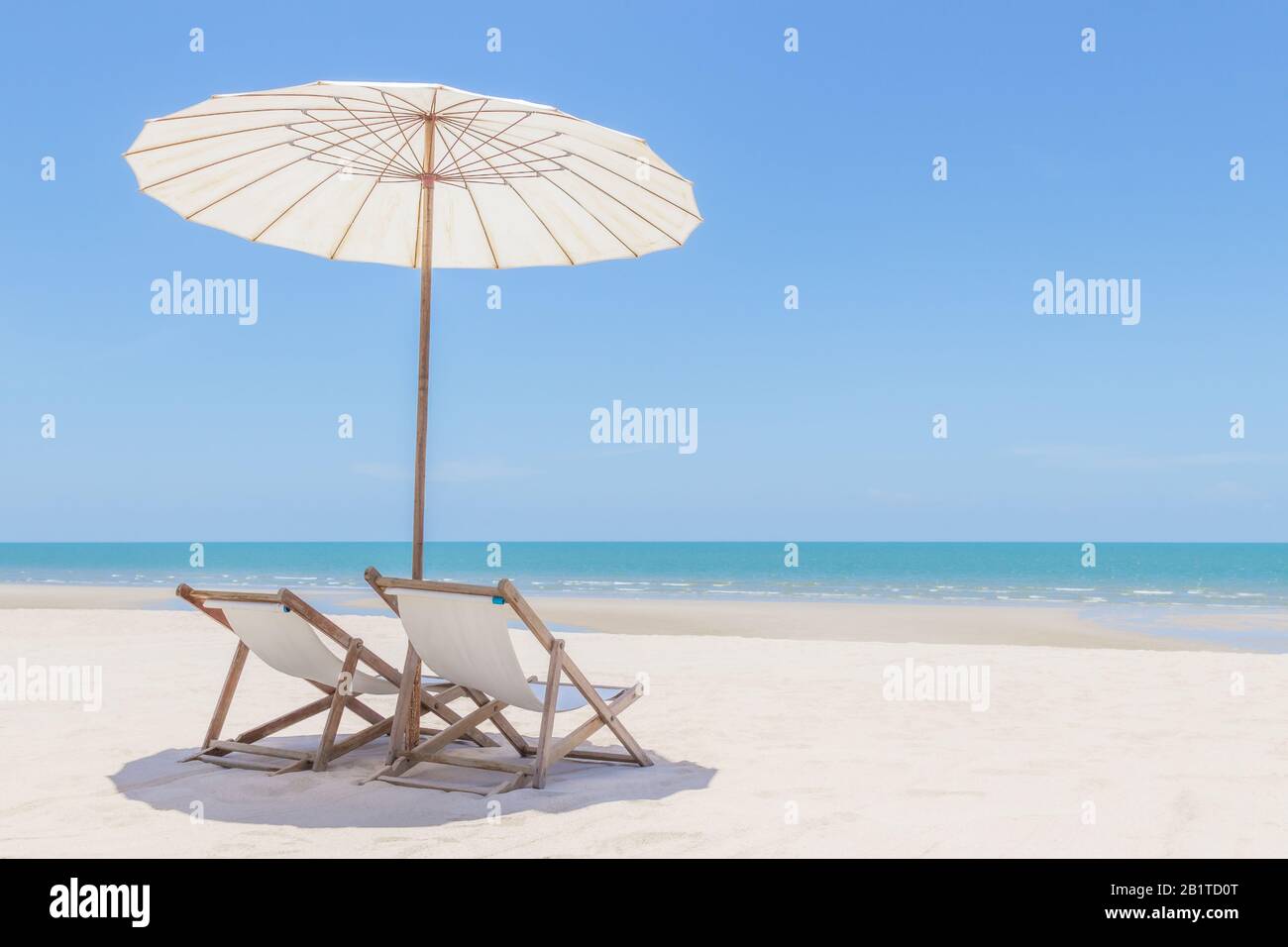 Idyllic tropical beach with white sand, turquoise ocean water and blue sky in huahin thailand Stock Photo