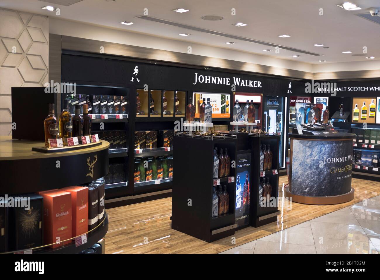 dh United Arab Emirates ABU DHABI AIRPORT UAE Duty free Johnny Walkers whisky display shop shopping mall Stock Photo