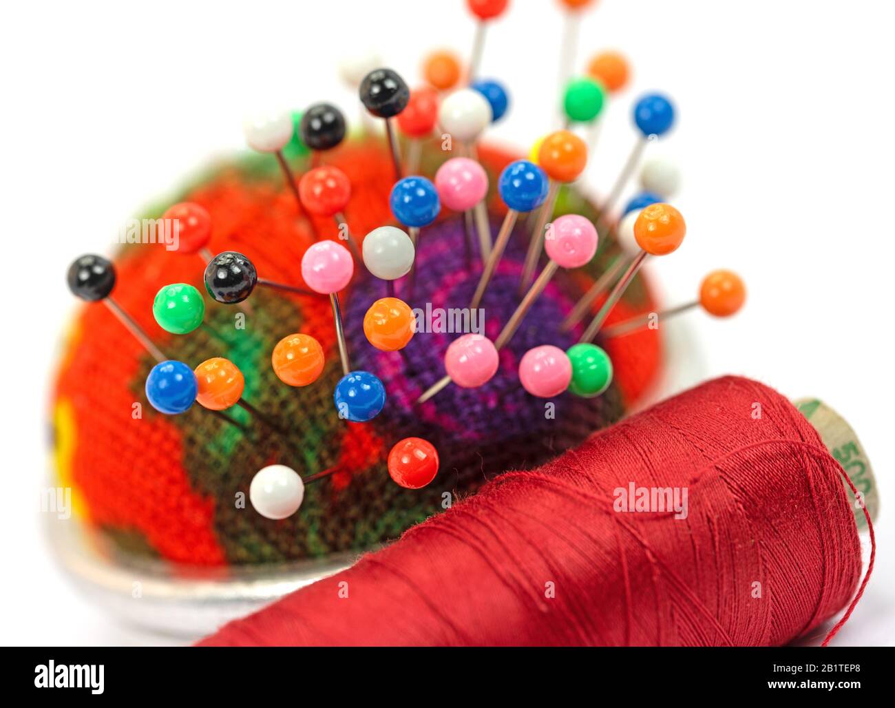 Sewing utensils against white background Stock Photo