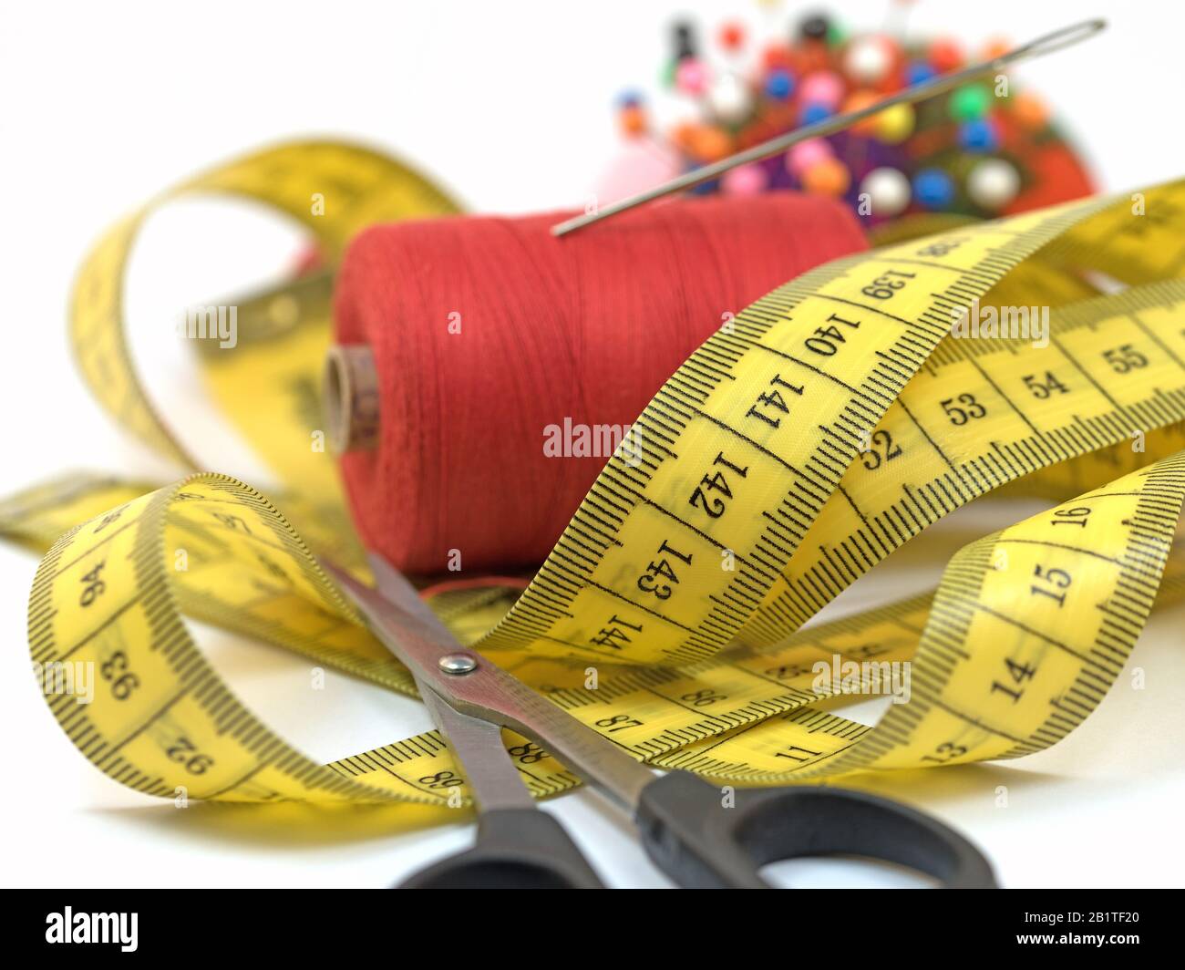 Sewing utensils against white background Stock Photo