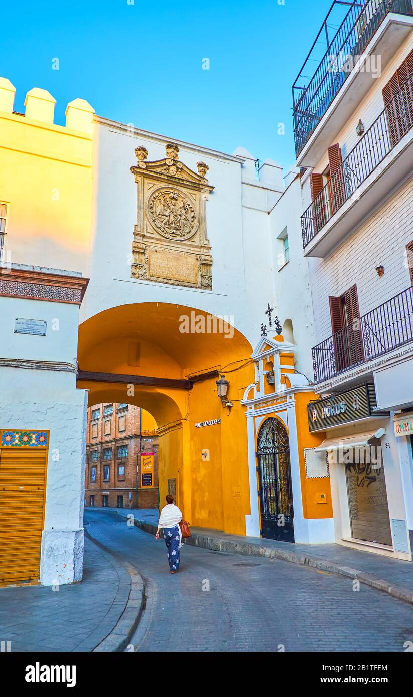 SEVILLE, SPAIN - OCTOBER 1, 2019: The historical Arco del Postigo is the preserved gates of medieval walls surrounding old town, during Muslim reign k Stock Photo