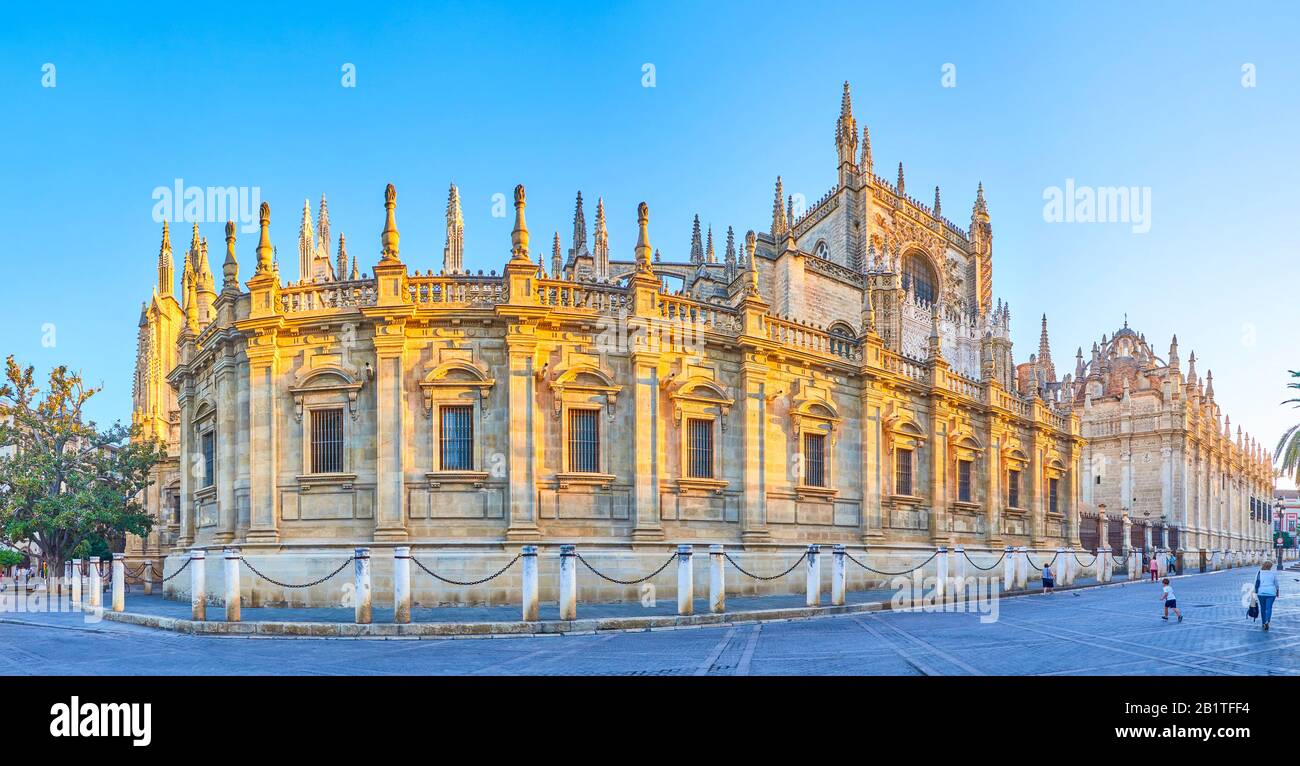 SEVILLE, SPAIN - OCTOBER 1, 2019: The large wall of the Cathedral council, the collegy of clergy on the side part of Cathedral, on October 1 in Sevill Stock Photo