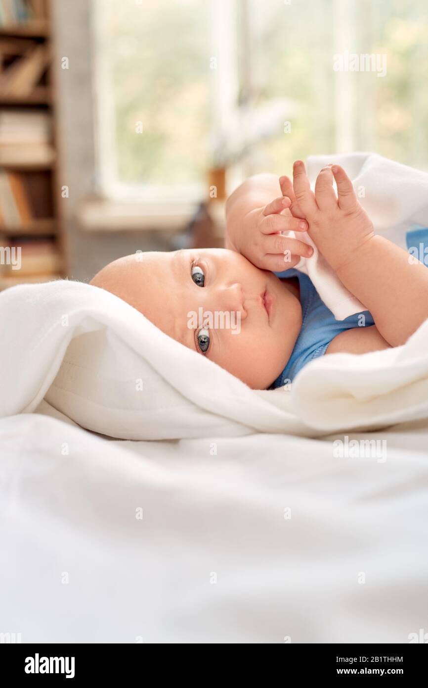 Cute little new born baby lying on bed Stock Photo Alamy