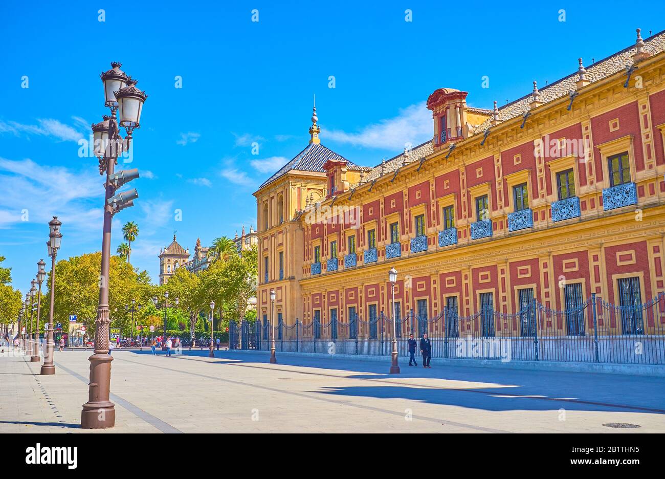 SEVILLE, SPAIN - OCTOBER 1, 2019: Walk along large Palacio de San Telmo (Palace of San Telmo) and enjoying magnificent Spanish Baroque style facade, o Stock Photo