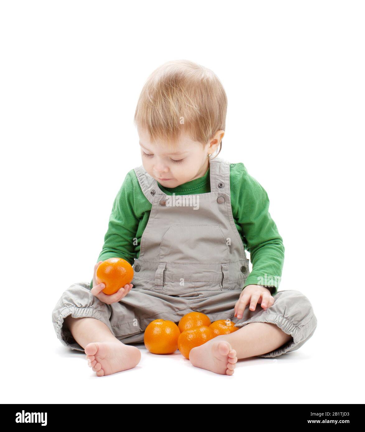 Baby with oranges. Isolated on white background Stock Photo Alamy