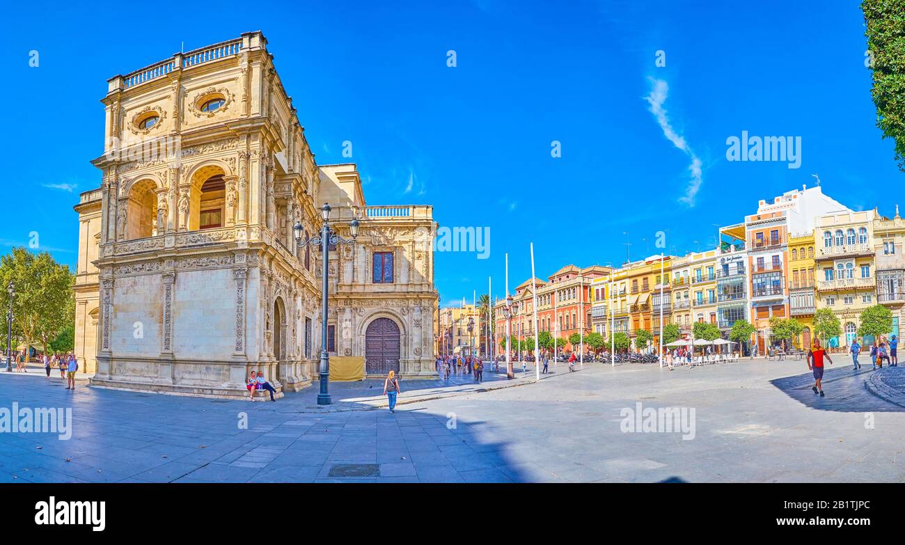 SEVILLE, SPAIN - OCTOBER 1, 2019: Panoramic view on Plaza de San Francisco with colorful buildings with outdoor terraces and monumental City Council b Stock Photo