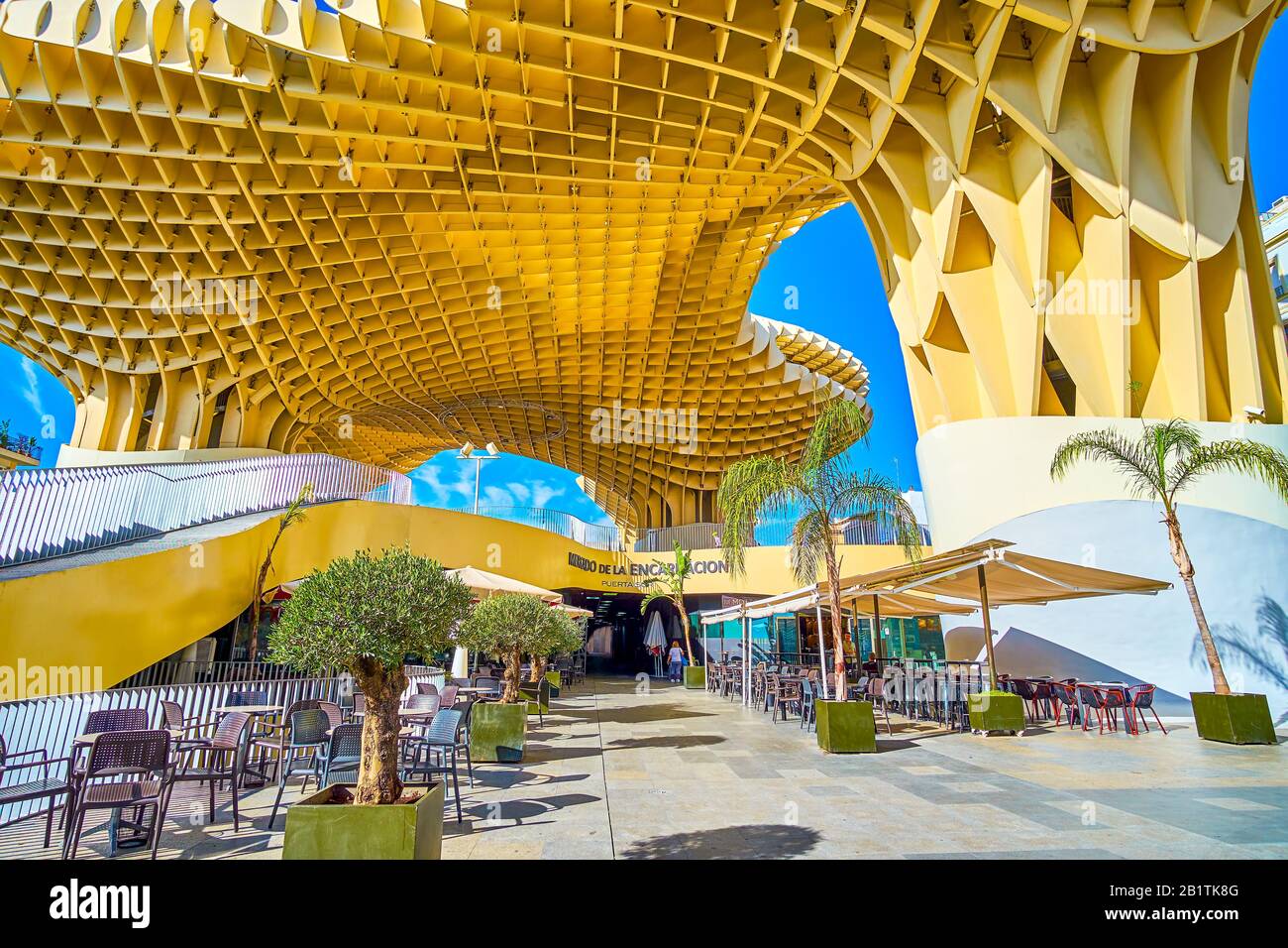 SEVILLE, SPAIN - OCTOBER 1, 2019: The entrance to the restaurant of Metropol Parasol complex with the outdoor terraces on the ground floor, on October Stock Photo