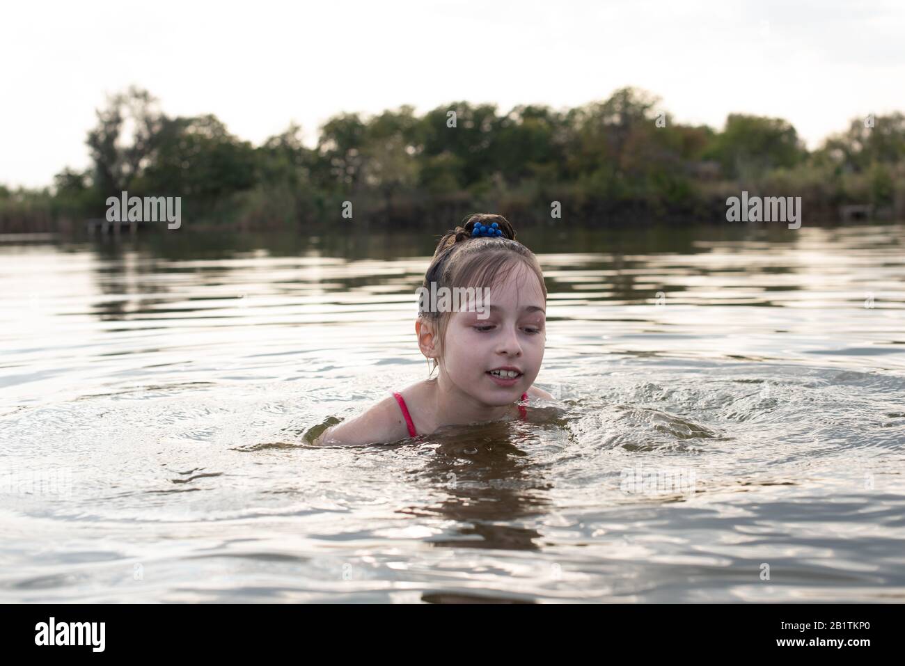 Pleasure Beautiful Little Girl Swim In Blue Water Lean Out Of Water And Smile Teenage Girl Enjoys The Warm Weather Stock Photo Alamy