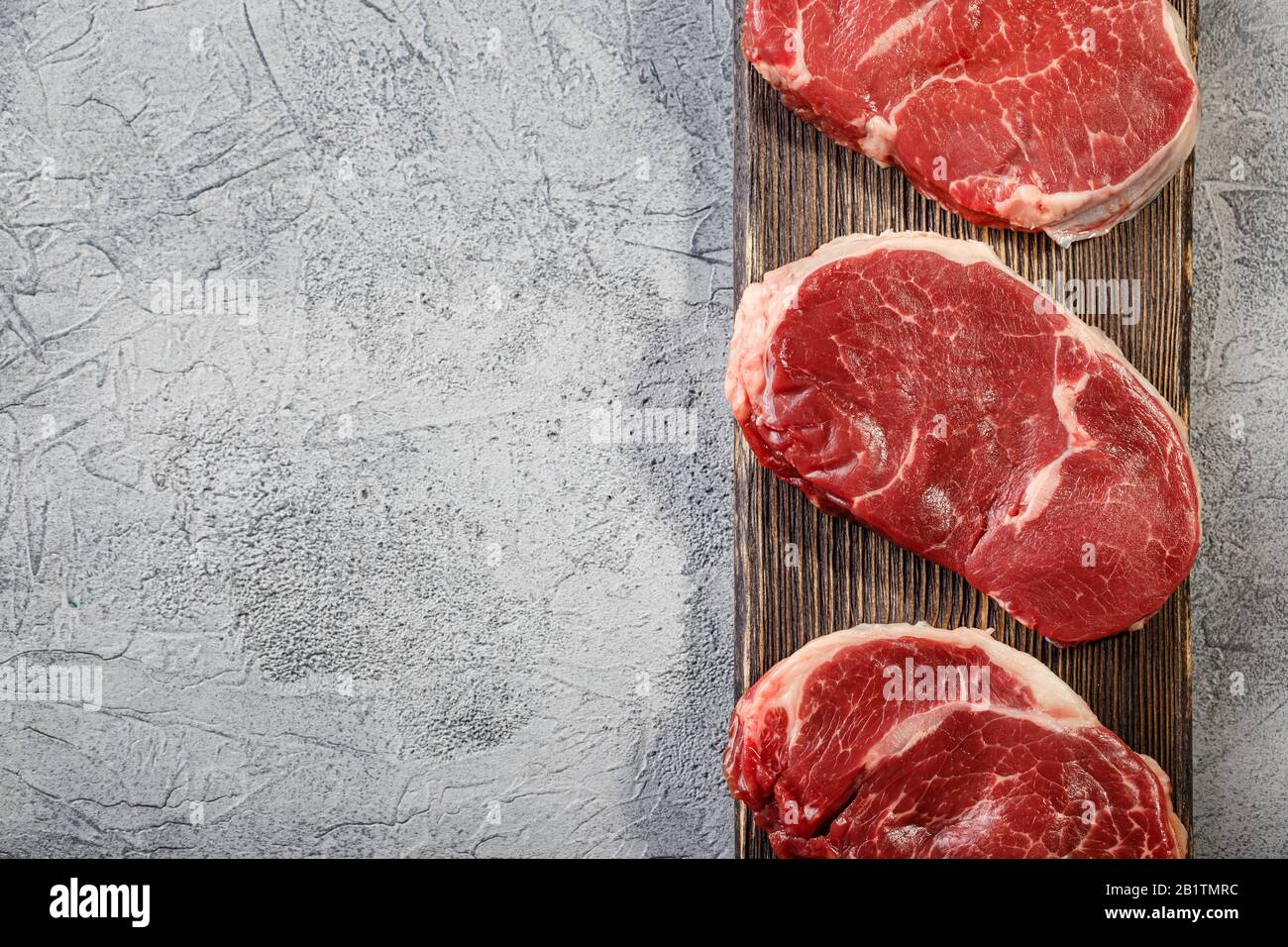 Three pieces of traditional thin steak cut from the tenderloin on