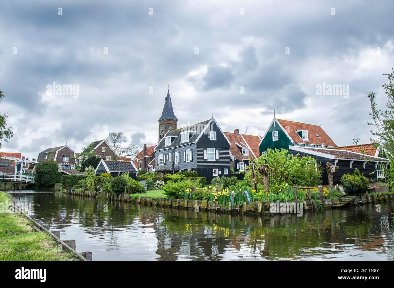view-of-canal-bridge-and-traditional-wooden-fishing-houses-in