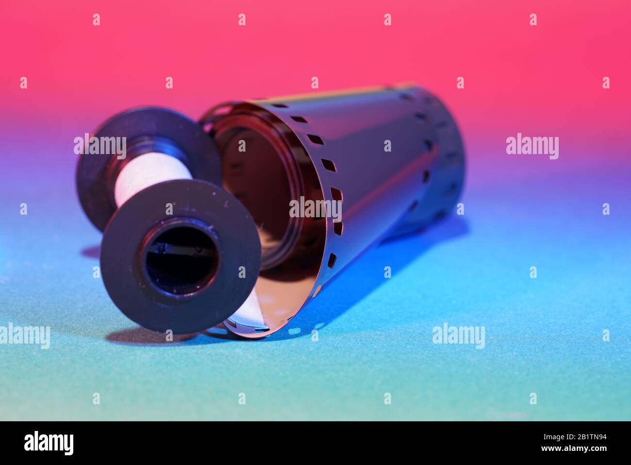 Film of an analogue camera with colorful background photographed in the studio Stock Photo