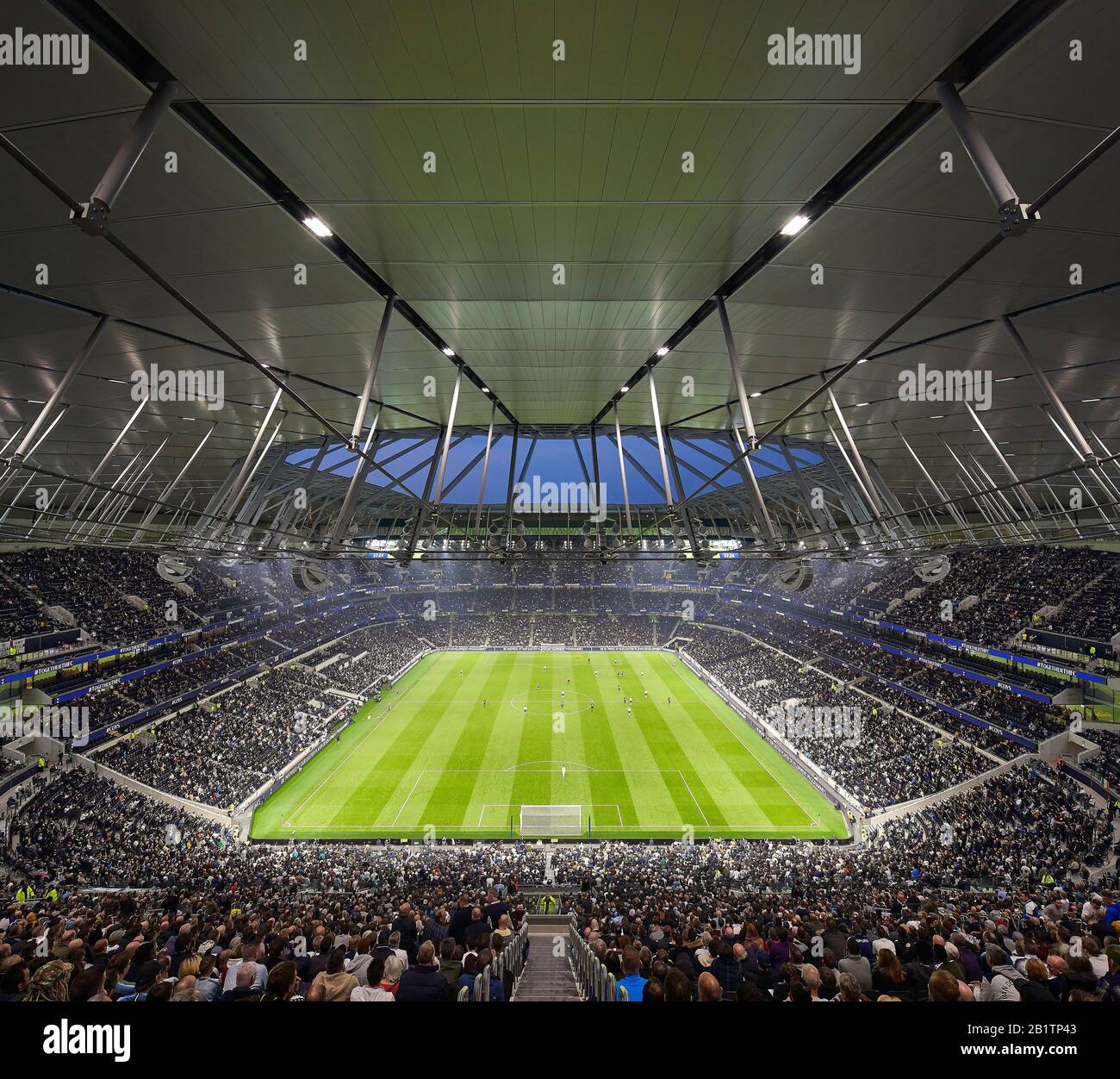 Stadium bowl looking north during event. The New Tottenham Hotspur Stadium, London, United Kingdom. Architect: Populous, 2019. Stock Photo