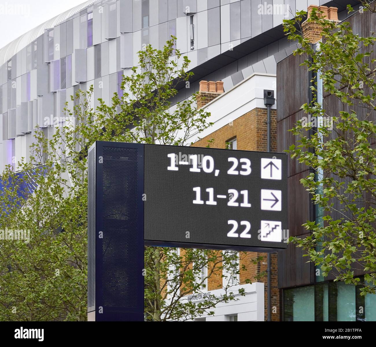 Wayfinding system next to stadium on street. The New Tottenham Hotspur Stadium, London, United Kingdom. Architect: Populous, 2019. Stock Photo