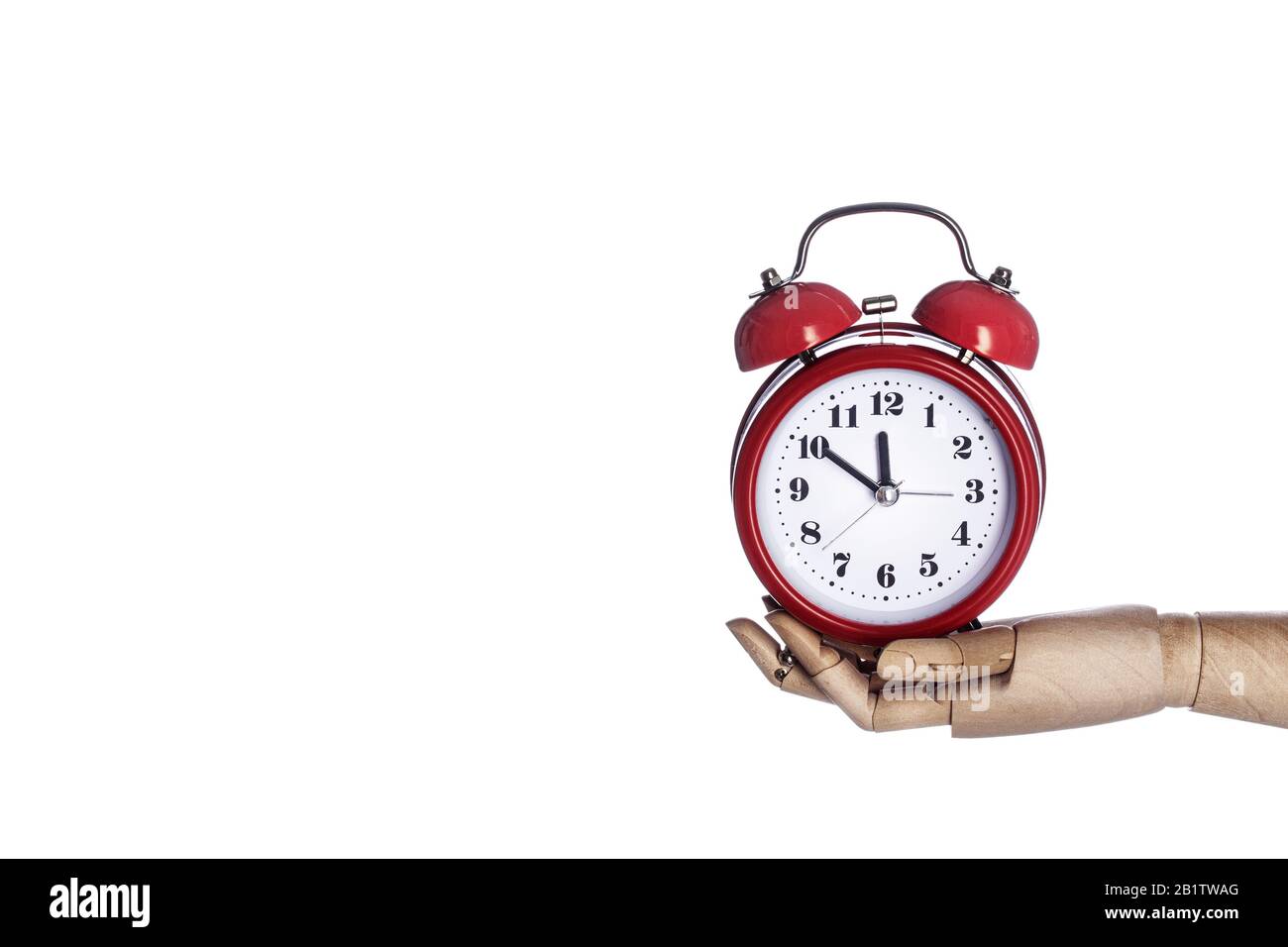 Wooden hand holding retro red alarm clock isolated on white background. Time management concept, business planning Stock Photo