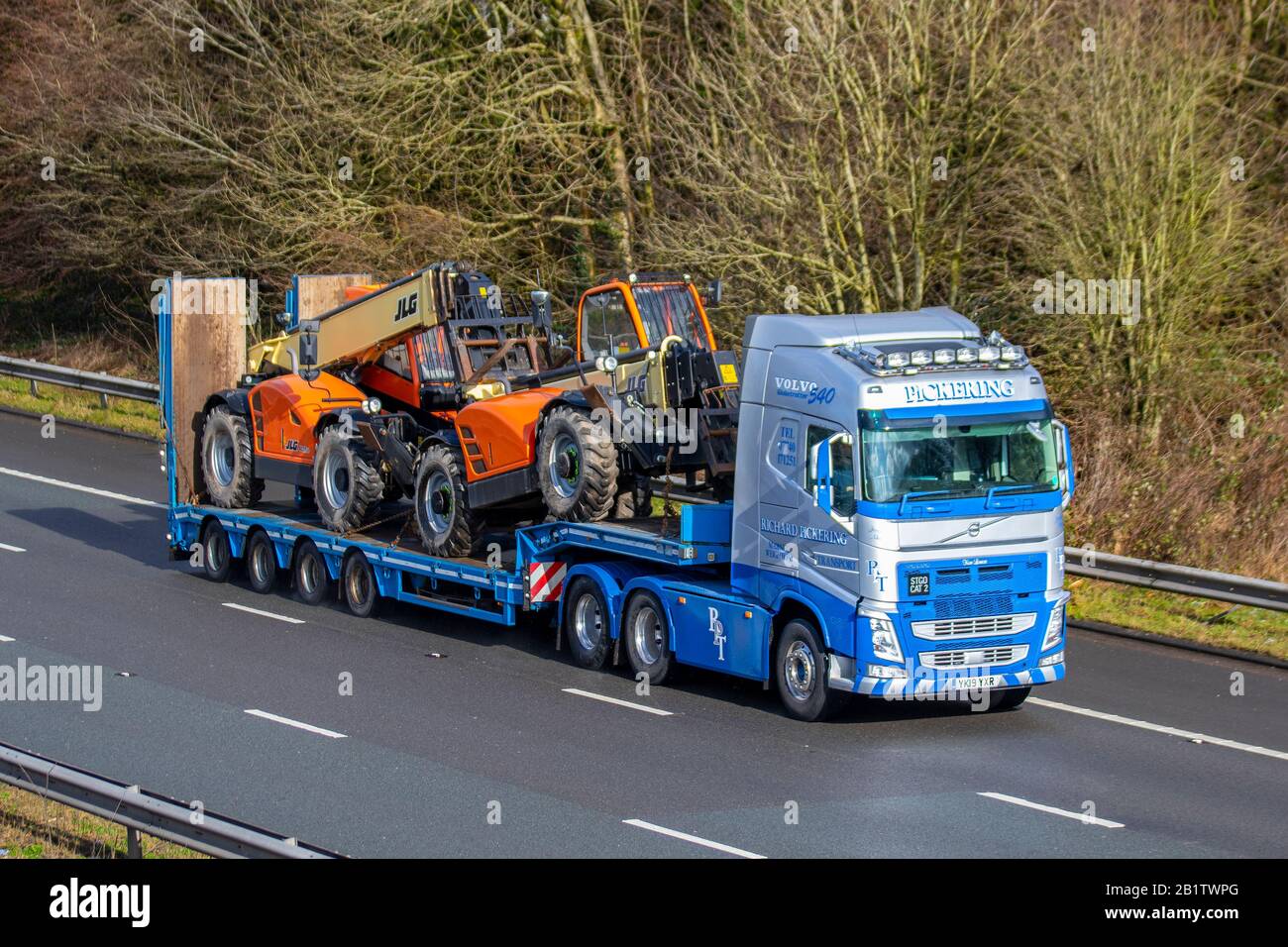 Richard Pickering Haulage delivery trucks, lorry, transportation, truck, cargo carrier, VOLVO FH540 Trucks, articulated Volvo vehicle, European commercial transport, plant & equipment for construction industry, M6 at Manchester, UK Stock Photo