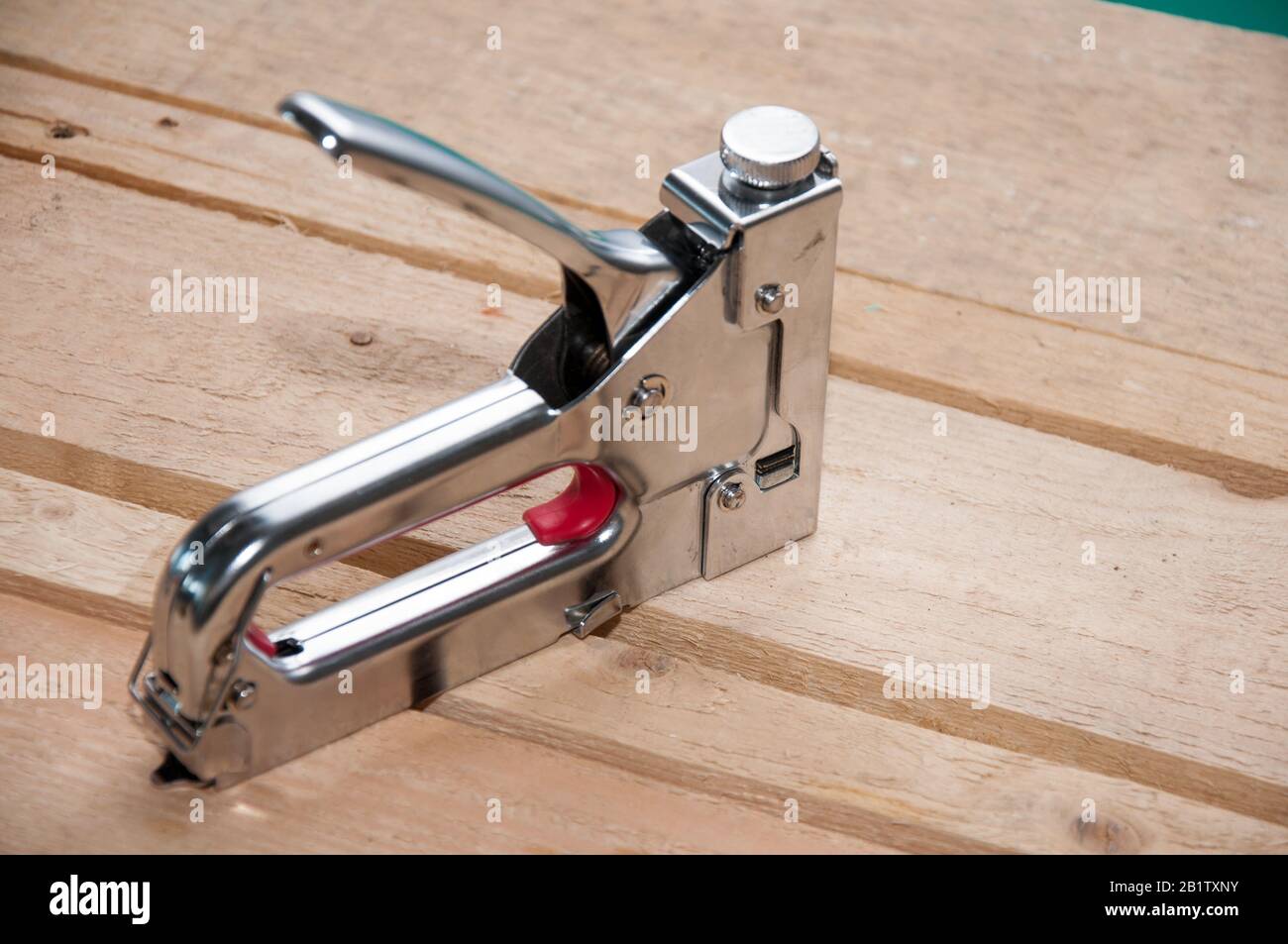 Carpenter Using an Industrial Construction Stapler on a Wood Plank Stock  Photo - Image of furniture, construction: 215806820