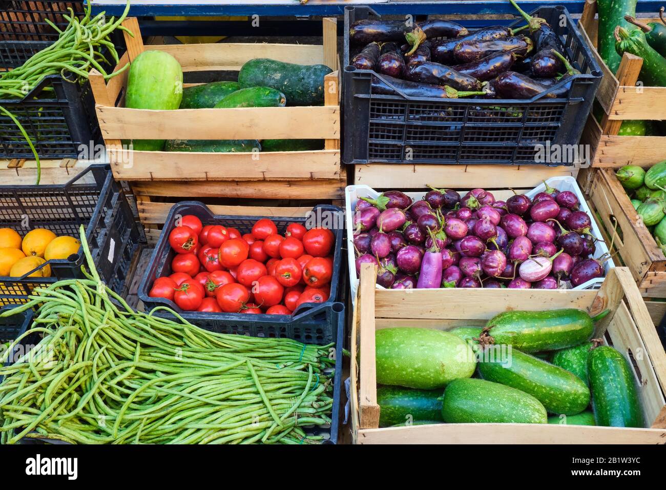 Fresh vegetables in wooden boxes for sale at a market Stock Photo - Alamy