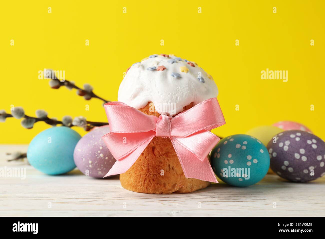 Composition with Easter cake on white wooden table, close up Stock Photo