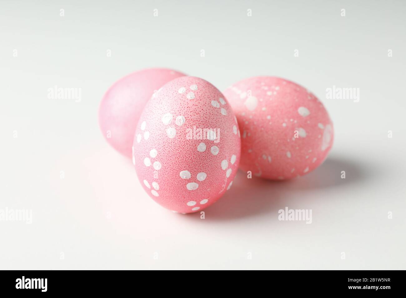 Pink easter eggs on white background, close up Stock Photo