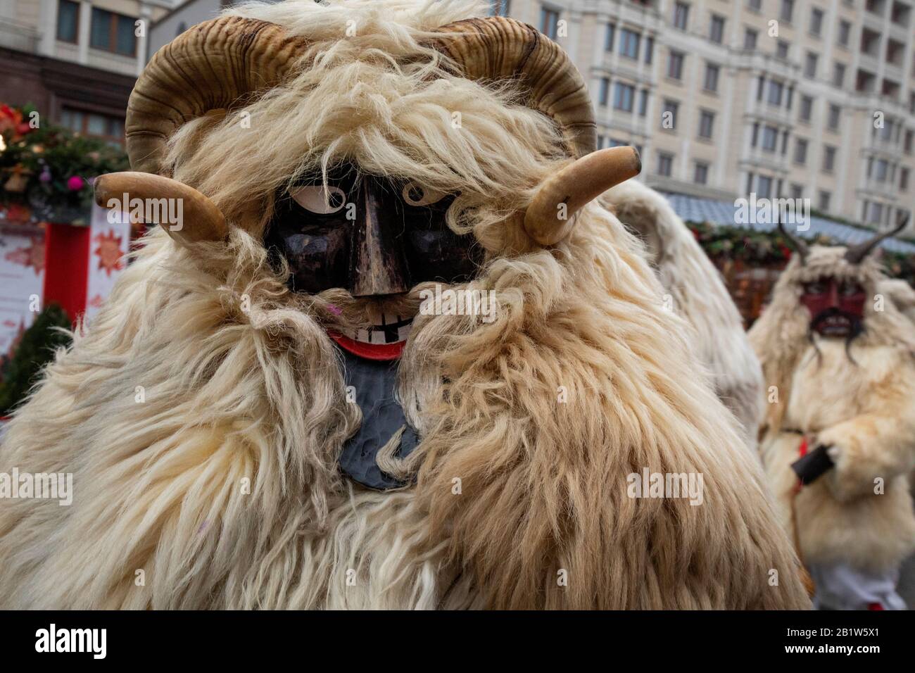 Moscow, Russia. 27th of February, 2020 People wearing traditional Hungarian masks and costumes (Busos) at the Carnival parade during celebration Maslenitsa holiday (Russian pancake week) on Manege Square in Moscow, Russia Stock Photo