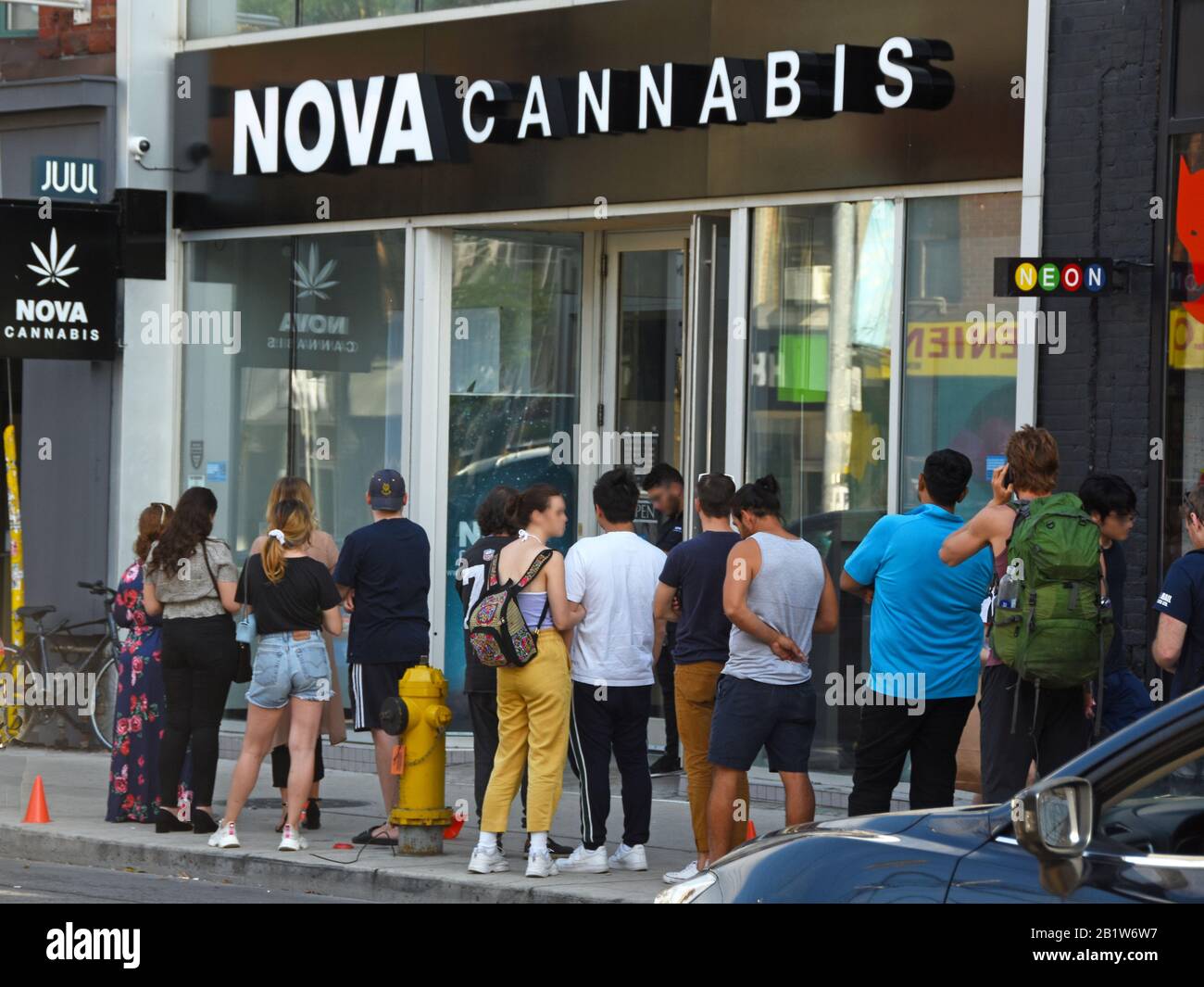 People stand in line to purchase legal cannabis in Toronto, Canada Stock Photo