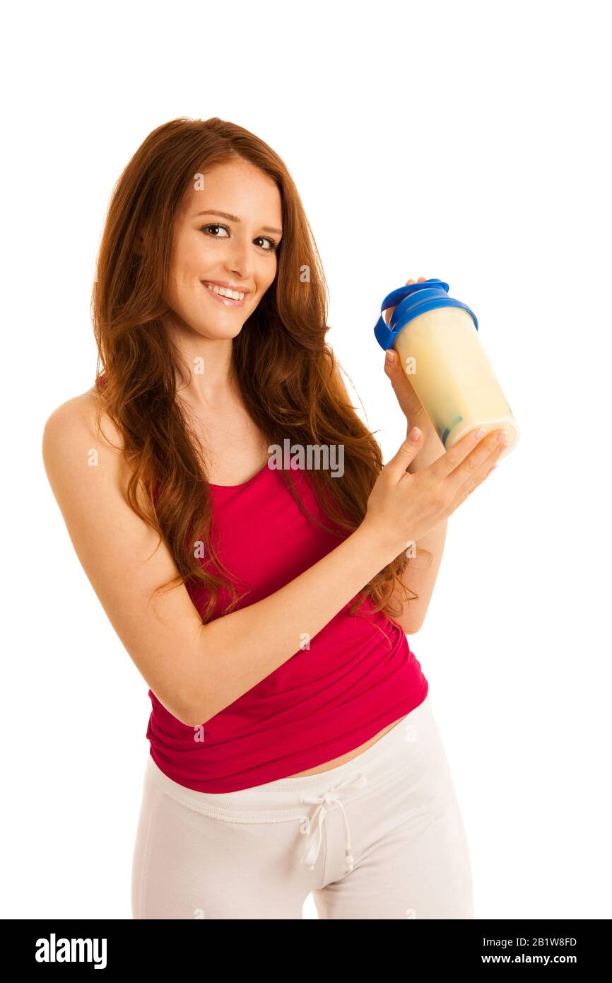 attractive beautiful sporty woman prepare protein shake in a shaker Stock Photo