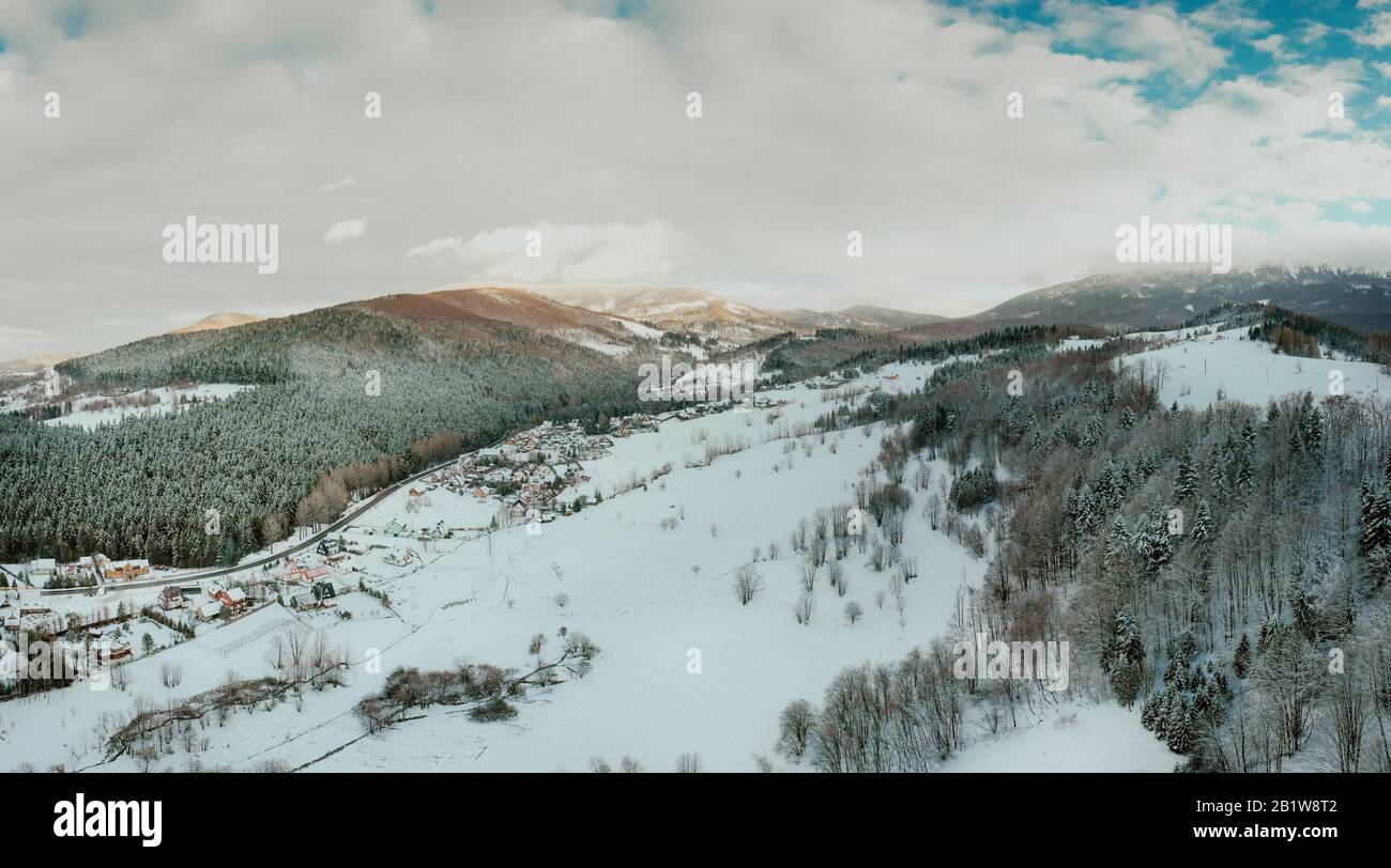 aerial View of small village in mountains in winter Stock Photo - Alamy
