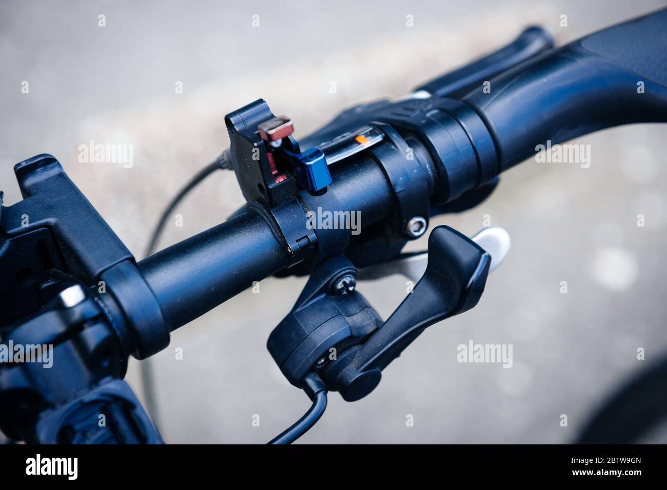 Shift lever change on modern bicycle handlebar steering wheel closeup macro shot Stock Photo